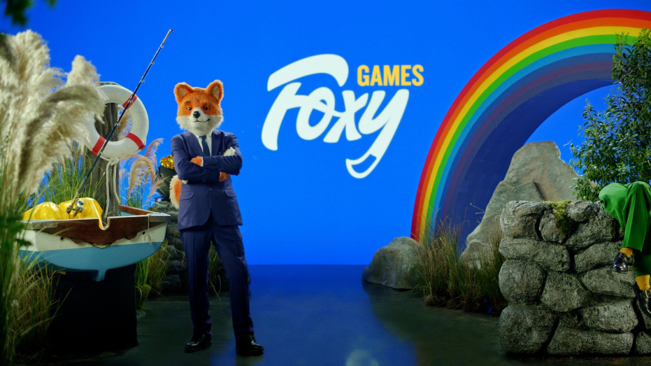 Foxy Games TVC still: Foxy in front of a rainbow